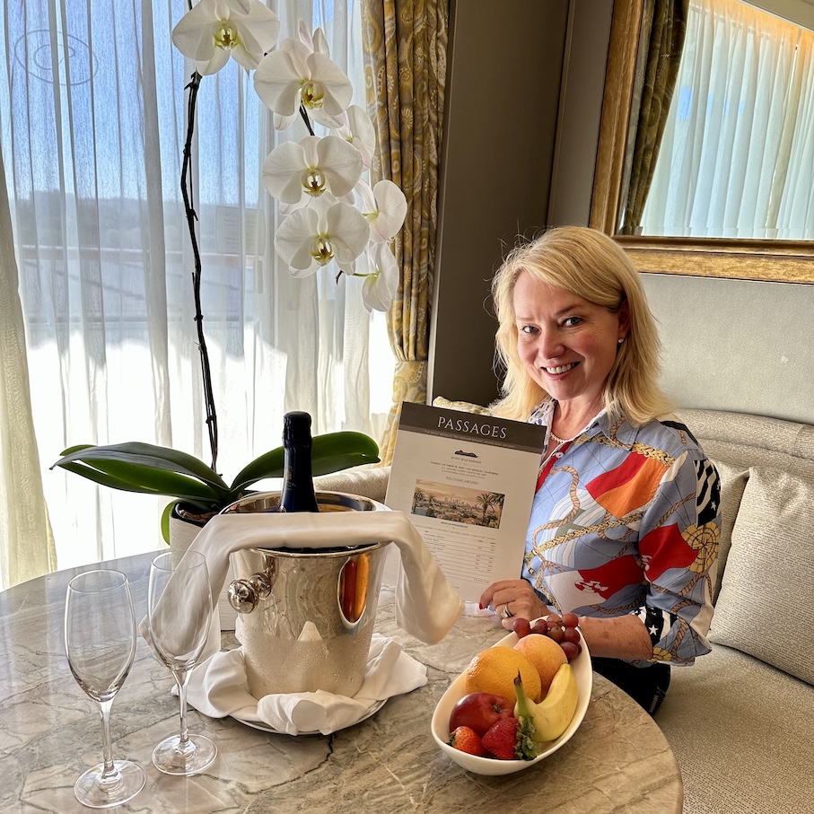 Julie, Ethos Luxury Advisors founder dining on board the seven seas mariner all-inclusive cruise.