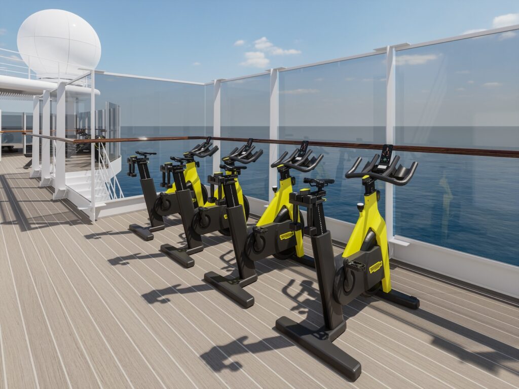 Open spin bikes on the deck of the Explora I Cruise