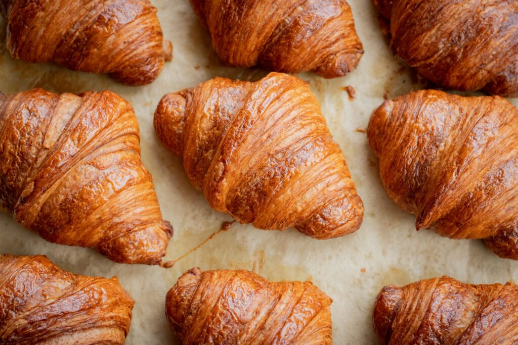 sheet pan of buttery croissants