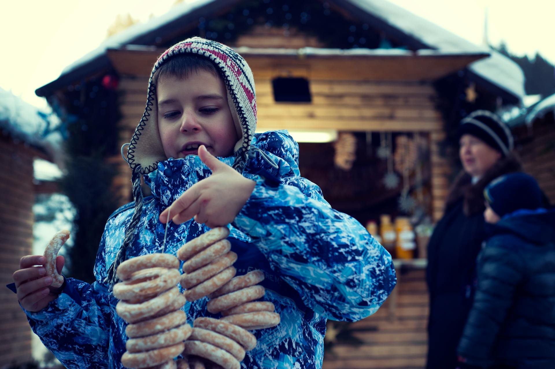 boy holding donuts during the holiday