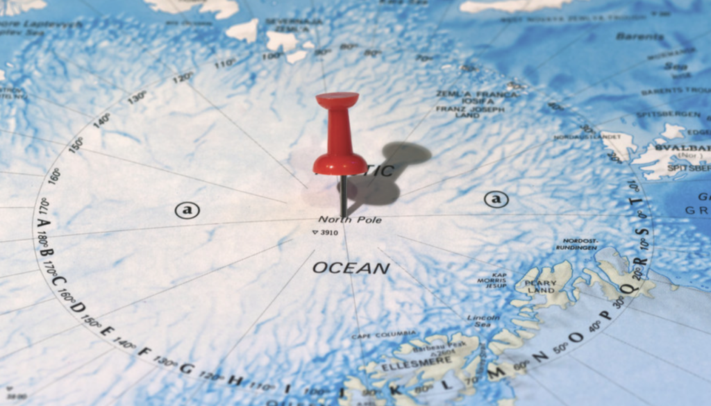 North pole marked on a map with a pin