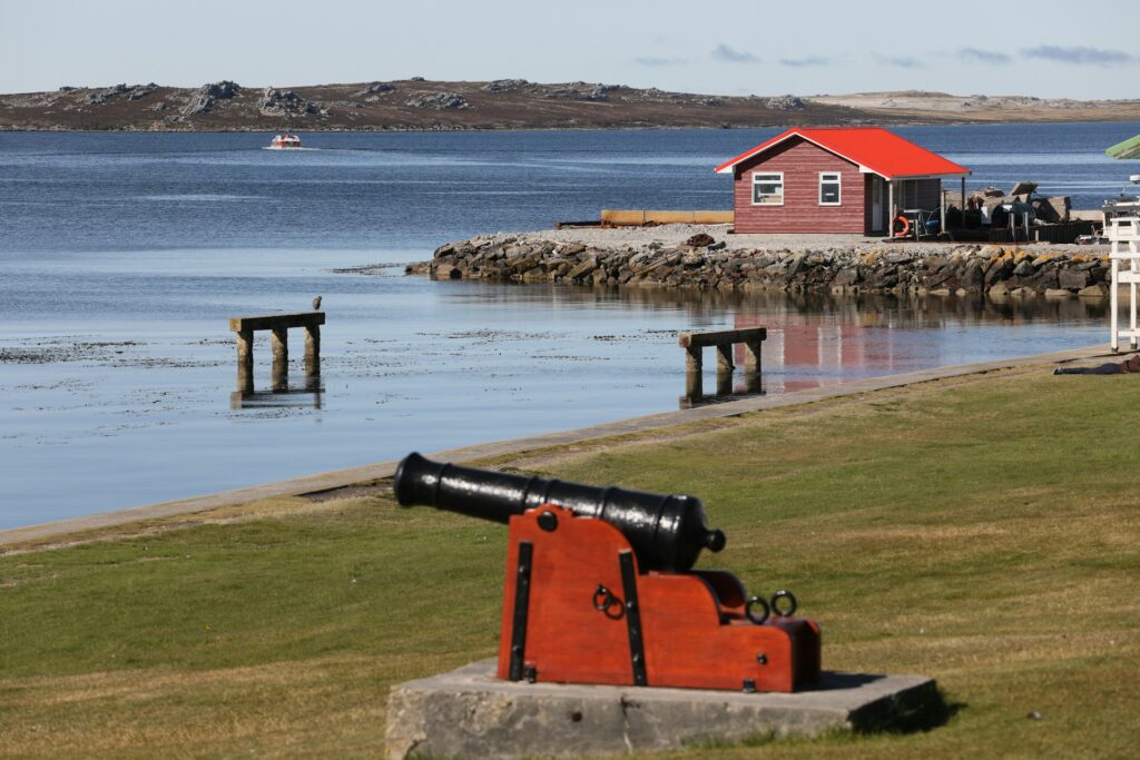 red cabin on the coast in Falkland islands