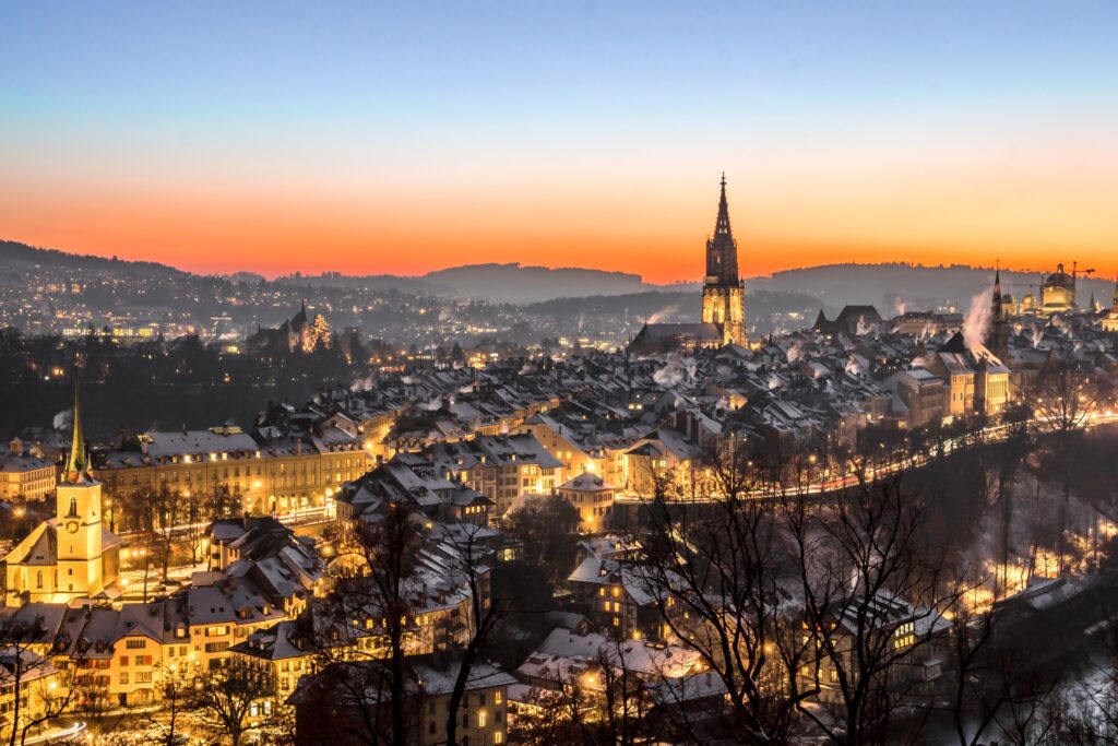 bern switzerland at twilight lit up with street lights