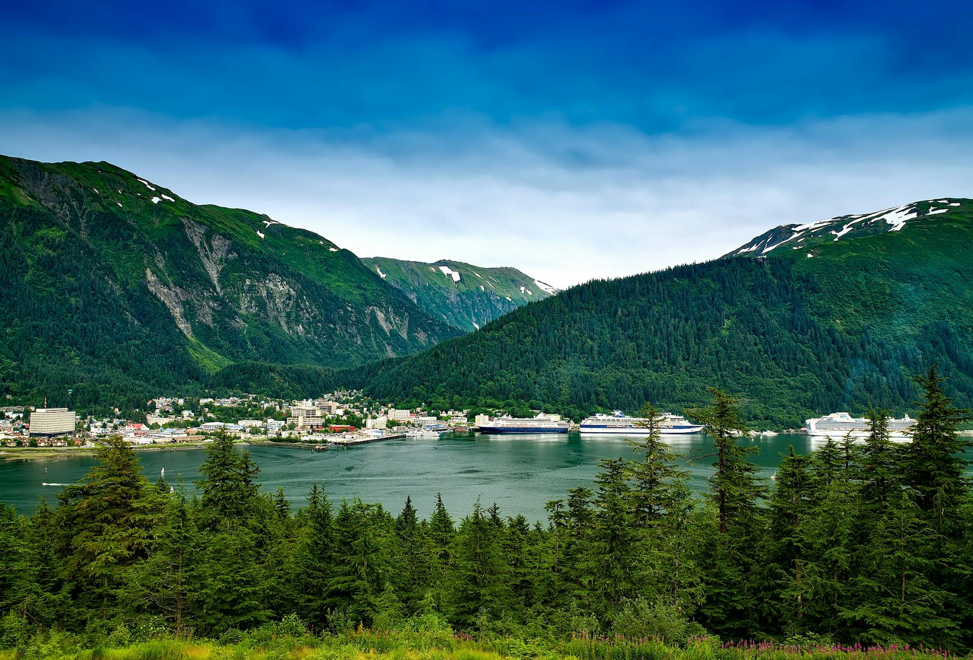 Blue Lake Surrounded by Mountains and Green Leaved Trees during Daytime in Juneau Alaska