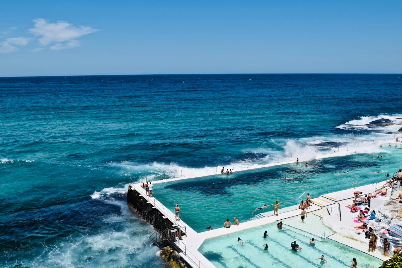 People at an ocean infinity pool on Bondi beach NSW australia