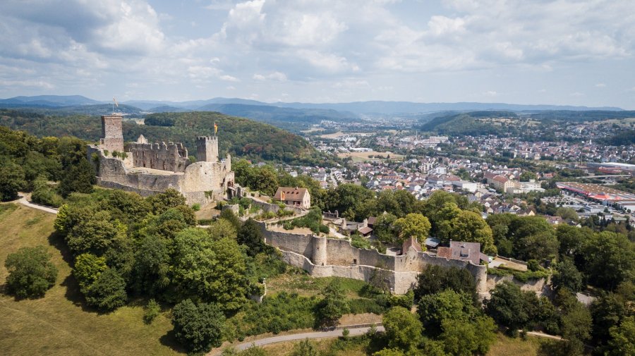 the remains of Rotteln castle on top of a hill overlooking a village