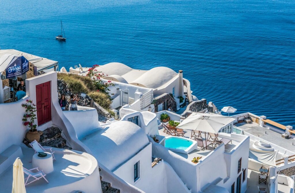 Santorini's iconic white buildings next to the ocean