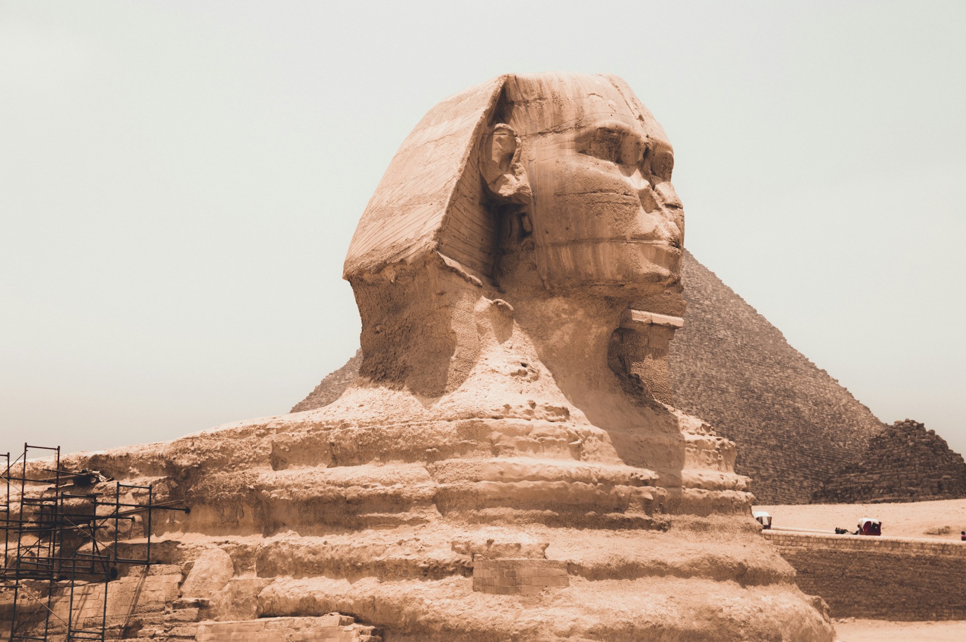 The sphinx front and center with the pyraids of giza behind it