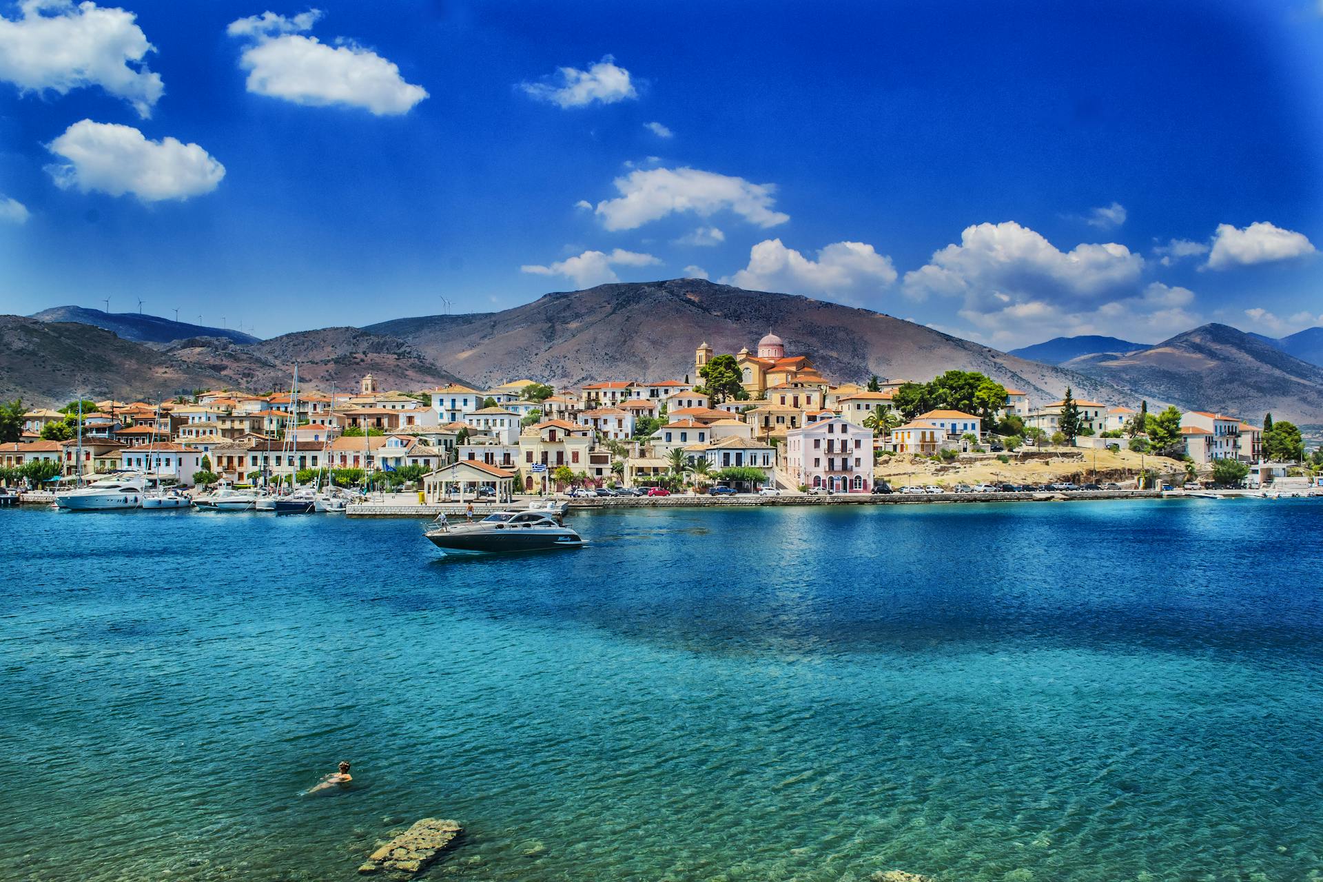 White and Black Boat Sailing in Body of Water in Galaxidi Greece