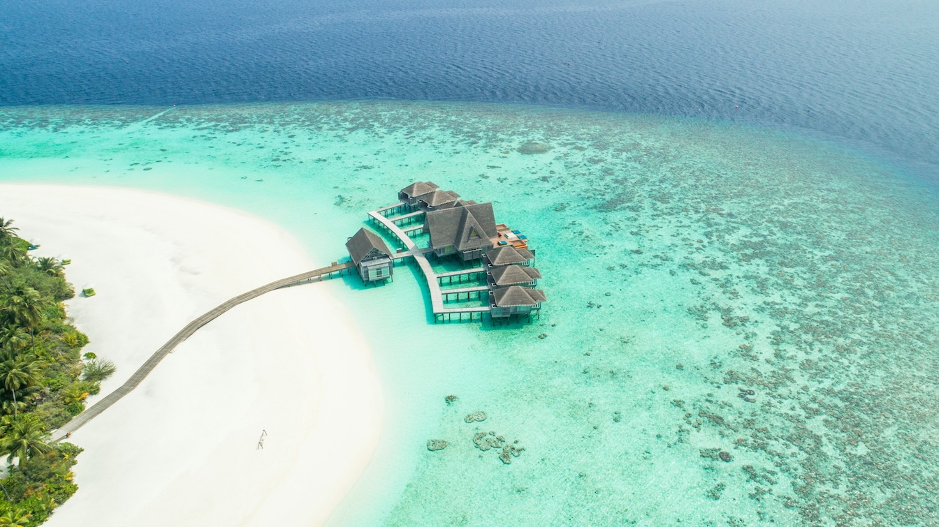 aerial photo of beach houses in Kihavah Huravalhi Island Baa Atoll, Maldives