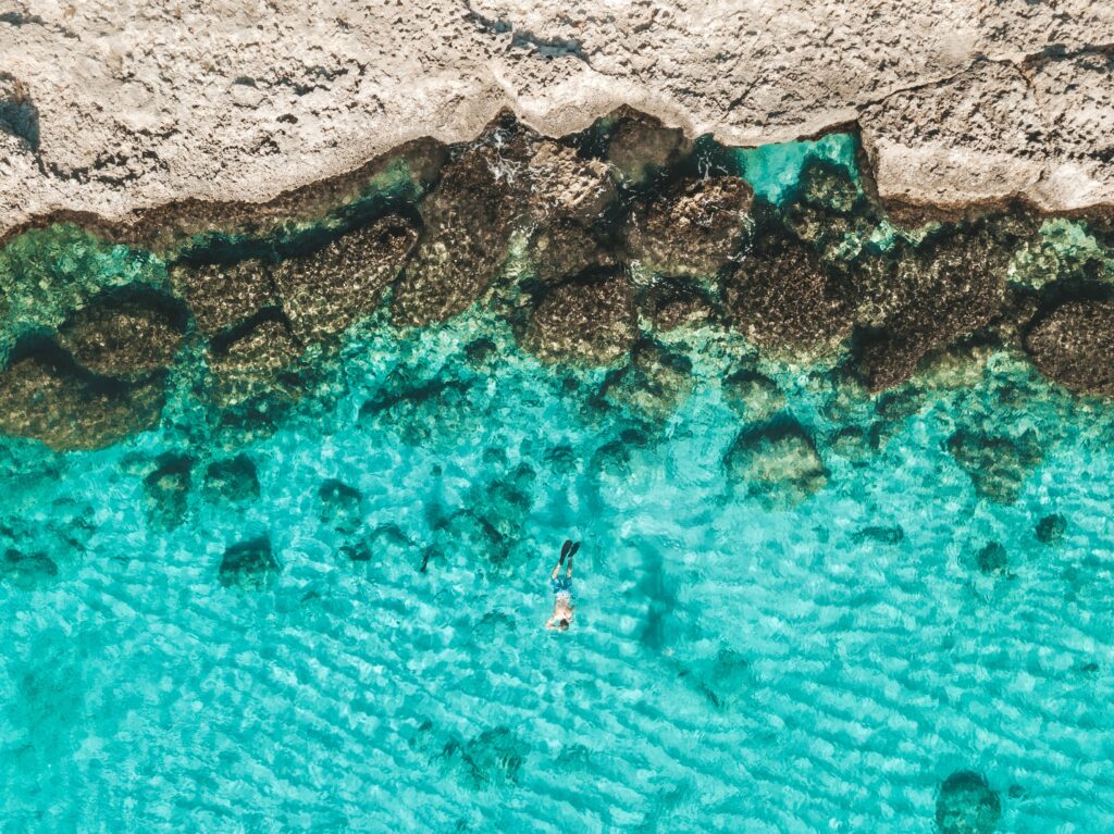 Aerial shot of clear blue waters in Aruba