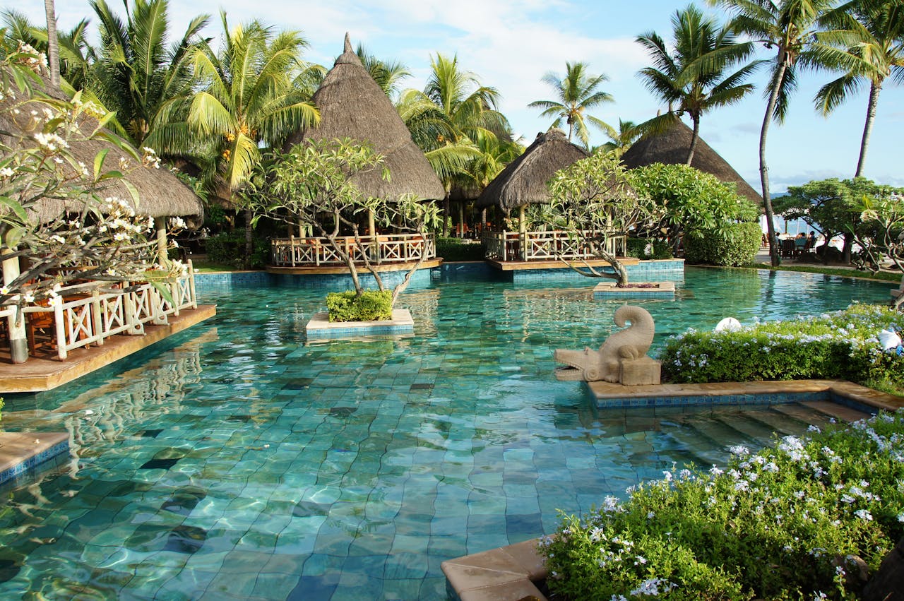 beach resort featuring overwater bungalows and crystal clear water