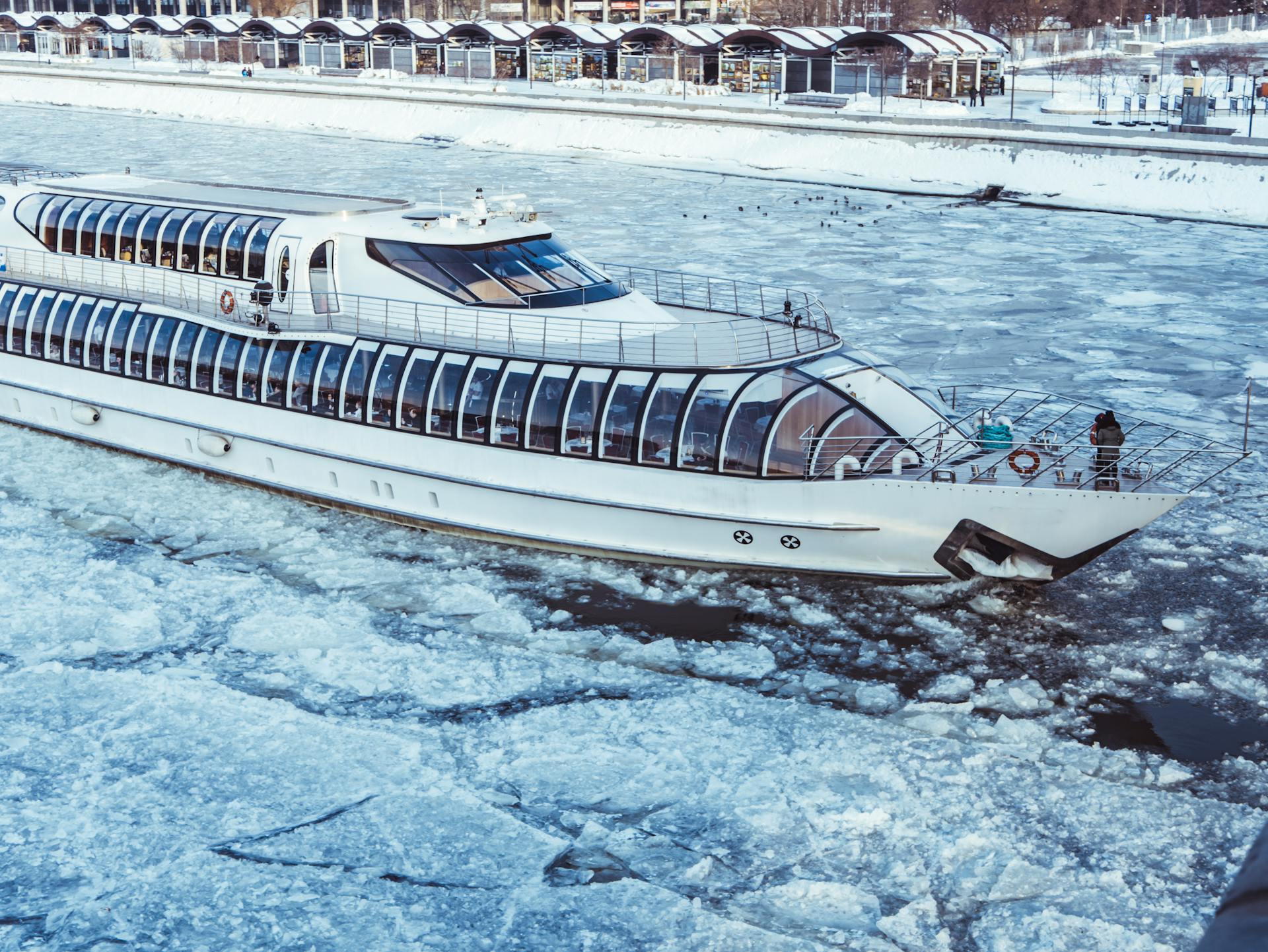 close up of white river cruise ship on an icy river