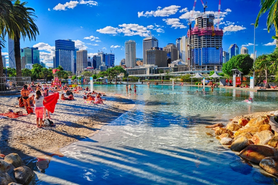 people on a beach during daytime in Brisbane