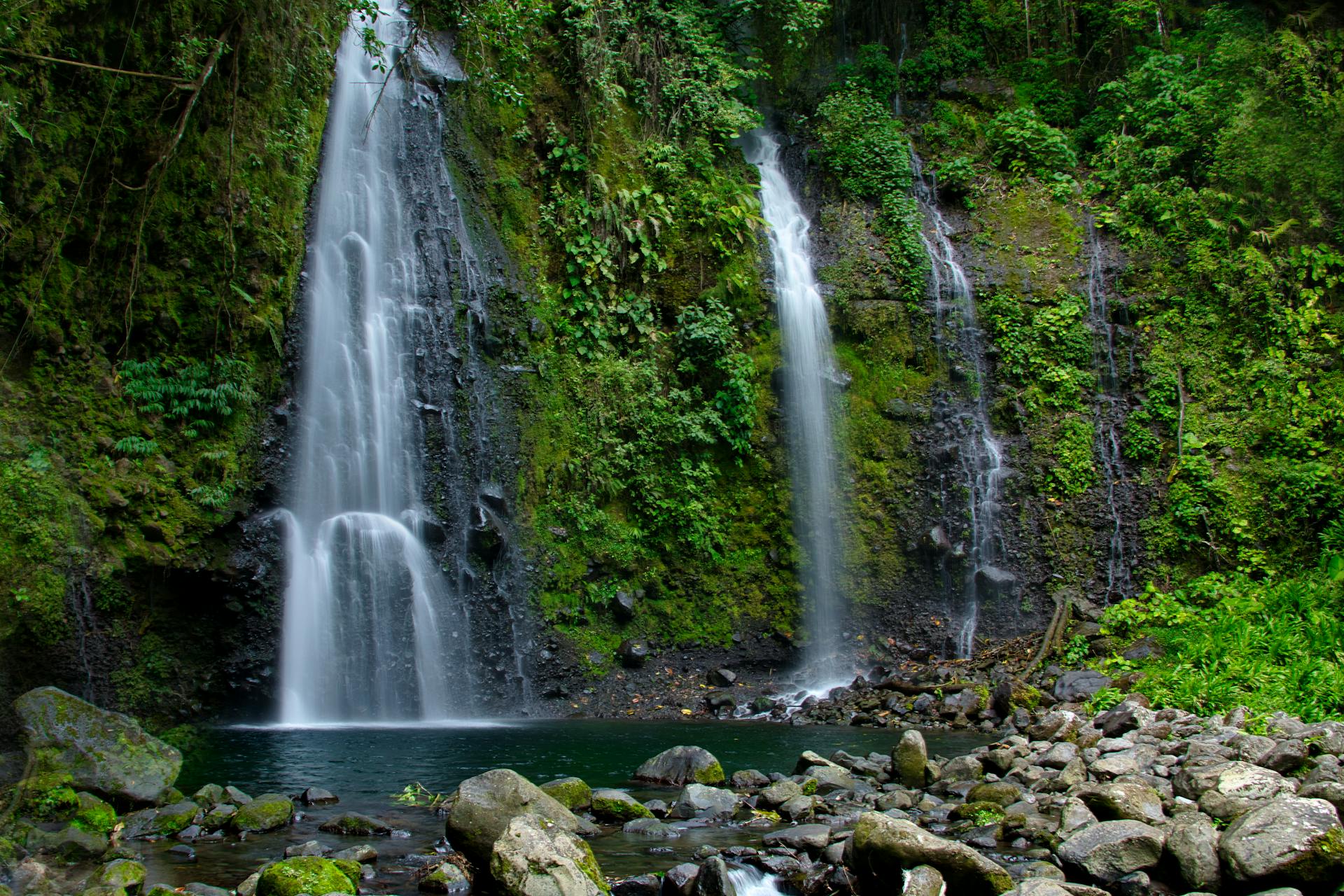 waterfall in the middle of a rainforest in cartago costa rica