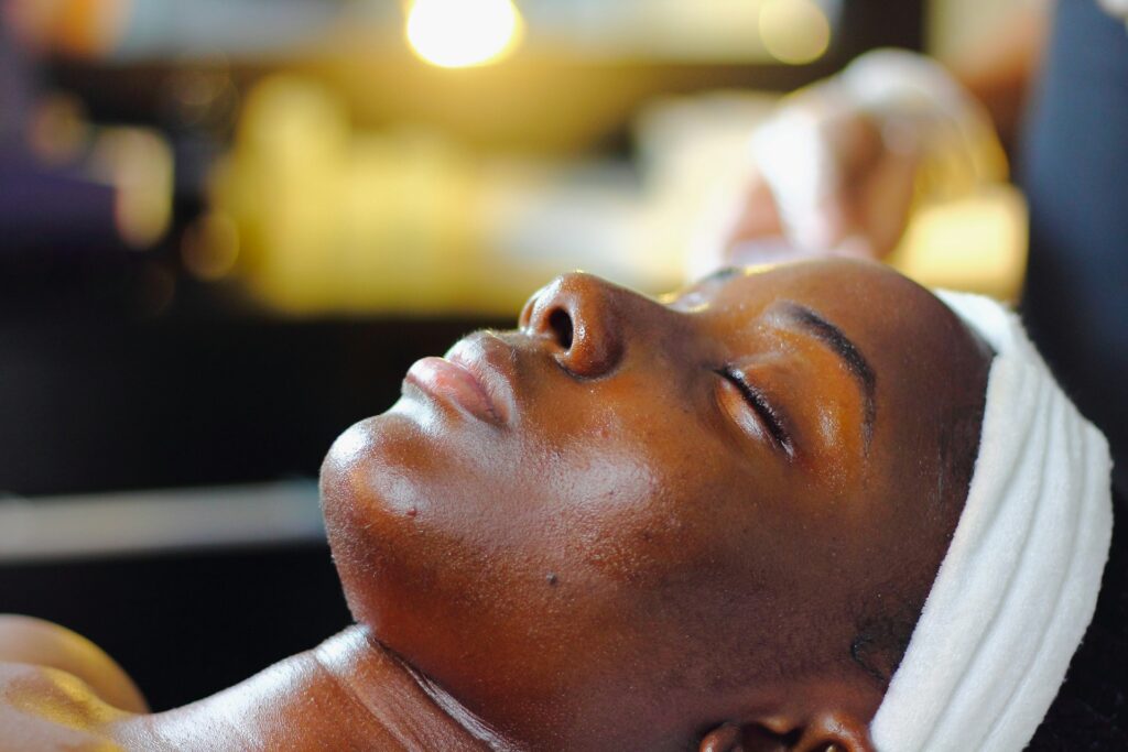 woman getting a facial at a spa