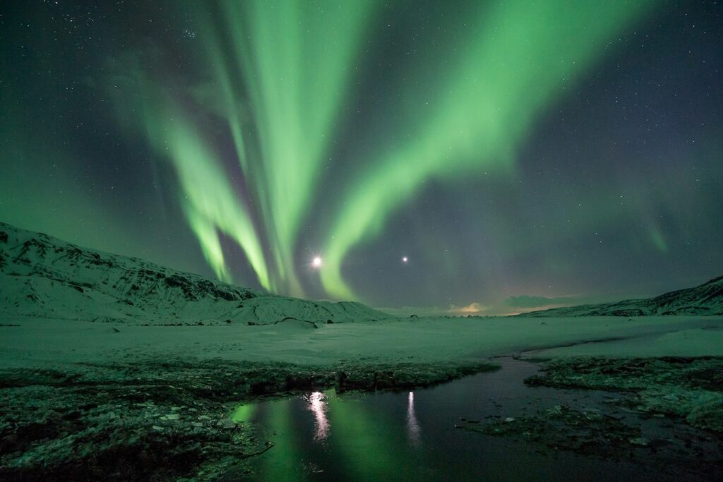 green northern lights or aurora borealis in iceland 